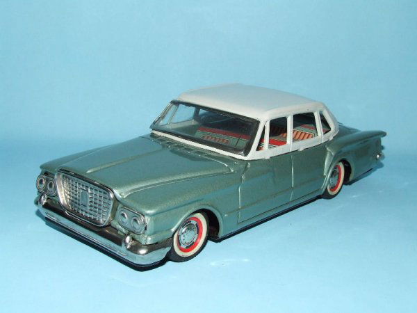 YONEZAWA 1961 VALIANT TIN FRICTION TOY CAR: 1960's. Japan. Working. Complete. All Original. Great detail. 9.25" L. (NM).