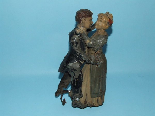 GUNTHERMANN WALTZING COUPLE TIN WINDUP TOY: 1910. Germany. Working. Man is missing 1 hand , woman is missing 1 arm, 2 solder repairs made to man's feet and 1 on his hand. All original. Hand painted with paint flaking throughout. (Fair).