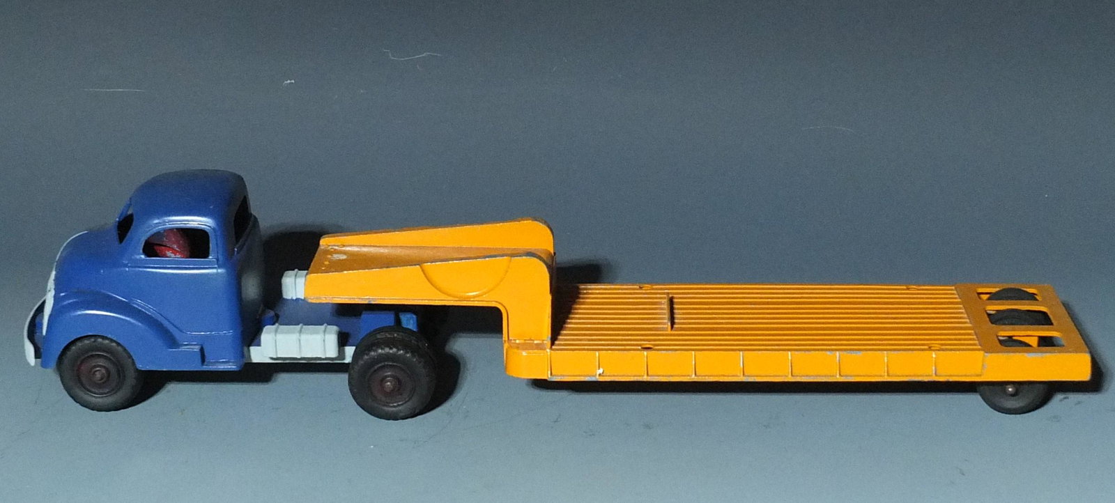 VINTAGE HUBLEY TRUCK & LOW BOY TRAILER: Vintage 1950's Hubley Diecast Metal Truck Cab and Lowboy Trailer. Cab has been re-painted. 19" L.