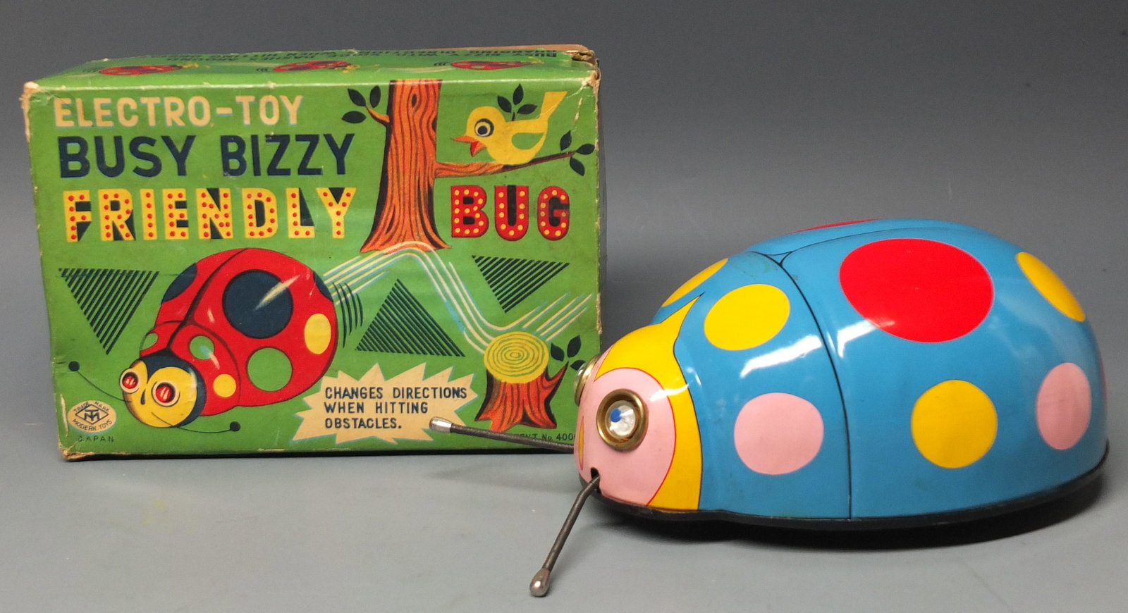 VINTAGE BUSY BIZZY FRIENDLY BUG BATTERY OP & BOX: Rare & Hard to Find, Vintage 1950's Masudaya Modern Toys Japan Busy Bizzy Friendly Bug Tin Litho Battery Operated Toy in the Original Box. Toy has never been played with. Working. 7" L x 2.5" H.