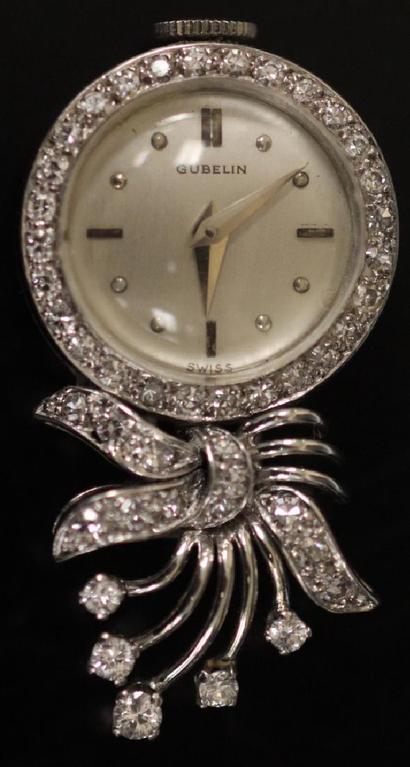 LADY'S DIAMOND 18KT GOLD GUBELIN WATCH PENDANT: Weight- 11 grams In-house shipping available within continental U.S. for $15 plus insurance.