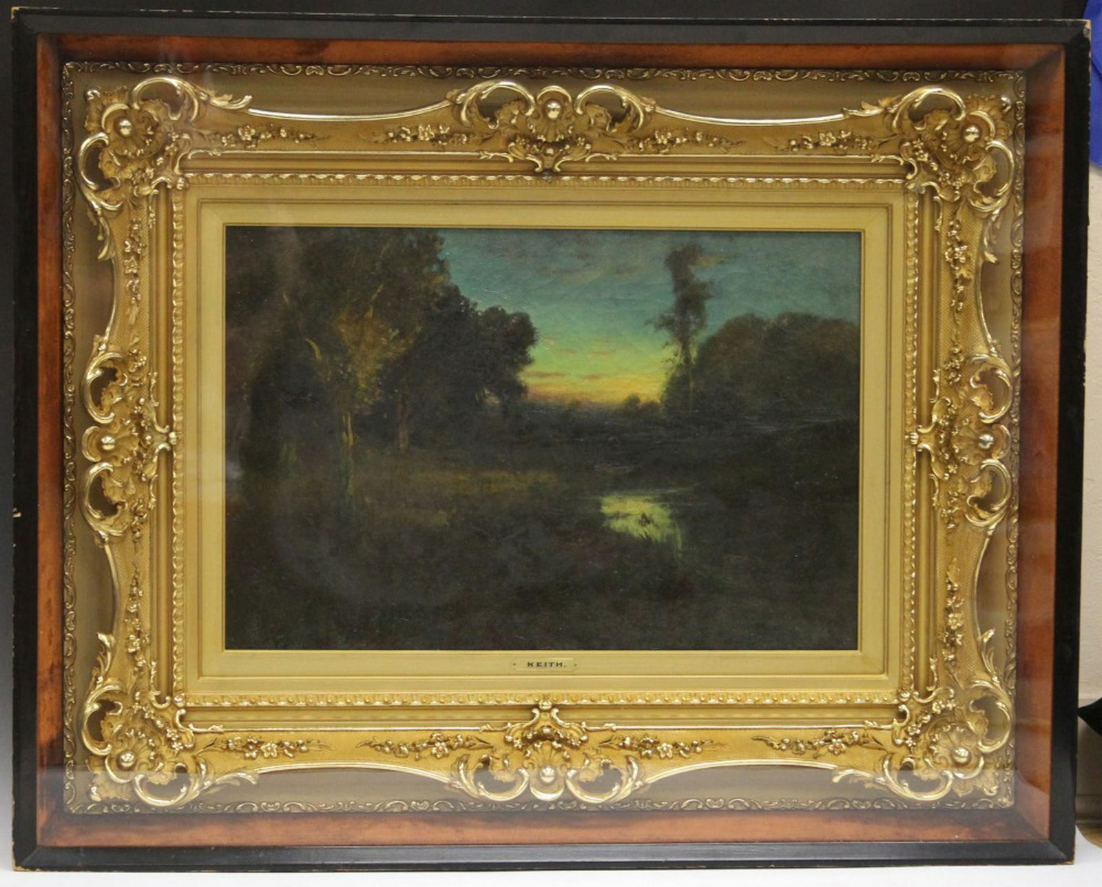 WILLIAM KEITH (1838-1911), OIL ON CANVAS: Framed oil painting of landscape with trees at sunset. Sight- 16" x 24" Overall- 28" x 36" Shadowbox- 30" x 38"