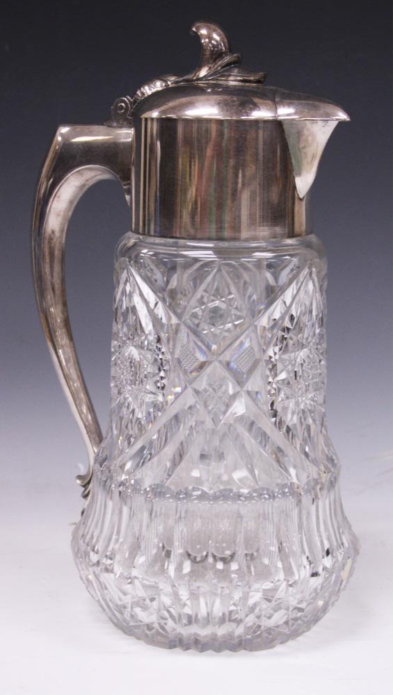 VINTAGE CUT CRYSTAL AND PLATED HANDLE DECANTER: Height- 14" Buyer is responsible to arrange shipment of this lot with 3rd party shipper. Please view our list of 3rd party shippers. All lots must be picked up or shipped by