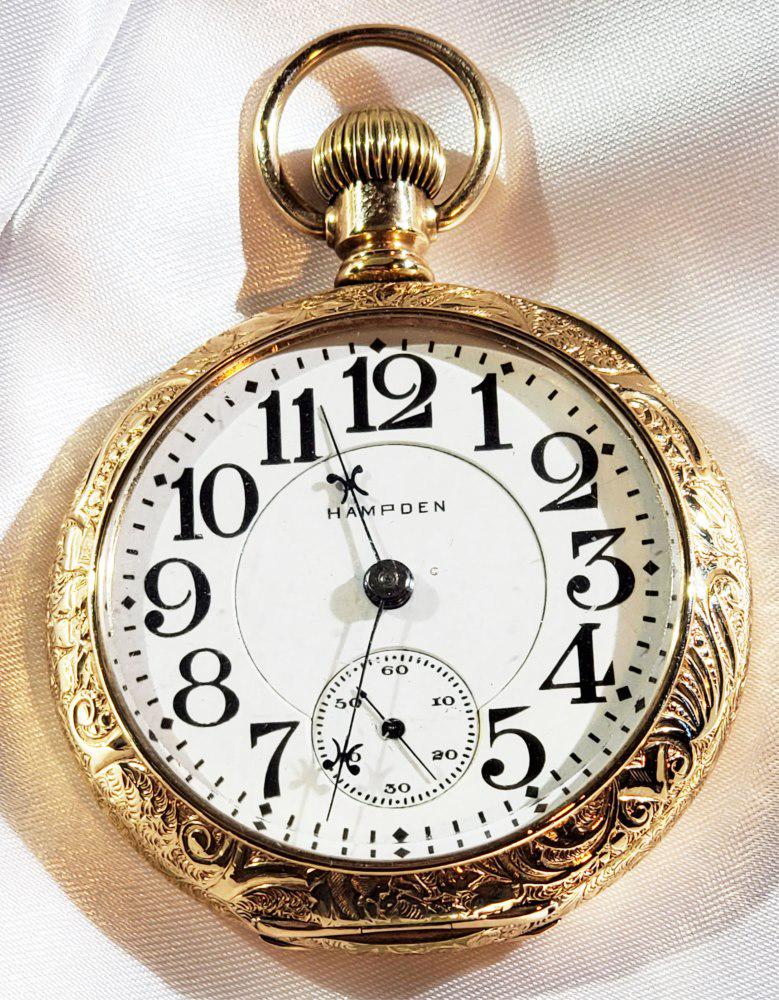 HAMPDEN GOLD FILLED ENGRAVED POCKET WATCH: with train engraving on backside