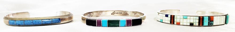 3 NATIVE AMERICAN SILVER INLAID CUFFS, SOME SIGNED: Condition- one with losses Weight- 93 grams Shipping U.S. $20 plus insurance