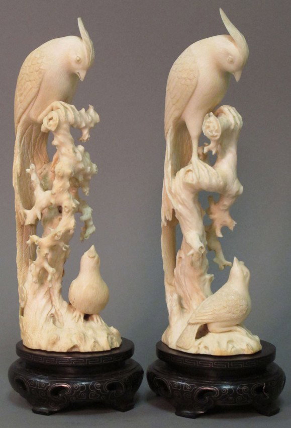 PAIR OF CHINESE CARVED IVORY BIRDS : - PAIR OF CHINESE CARVED IVORY BIRDS with stands height: 8 3/8" (ivory only) note: minor chip to one bird feather