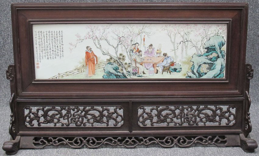 CHINESE PORCELAIN TABLE SCREEN with carved base no: CHINESE PORCELAIN TABLE SCREEN with carved base note: some wear on wood porcelain: 8 3/8"x 29 1/8"