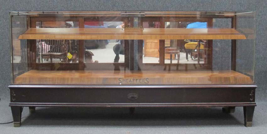 SHEAFFER'S PENS AND PENCILS DISPLAY CASE early 20t: SHEAFFER'S PENS AND PENCILS DISPLAY CASE early 20th century height: 42", length: 88" depth: 25" estimate 600-900