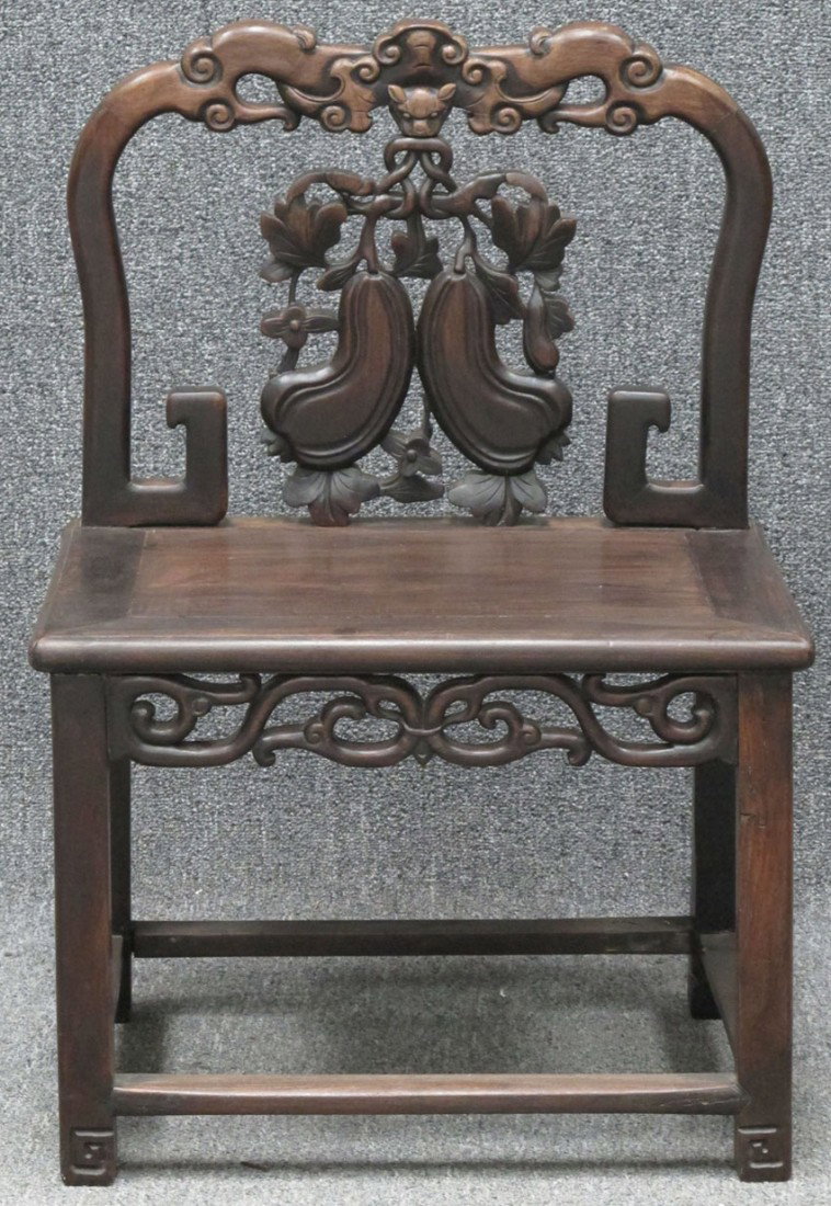 CHINESE CARVED ROSEWOOD CHAIR with carved fruit de: CHINESE CARVED ROSEWOOD CHAIR with carved fruit decoration height: 31",width: 16 1/2" length: 21 1/4" estimate 200-400