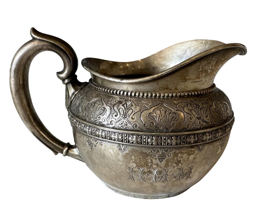 TIFFANY & CO. STERLING SILVER CREAMER: Weight- 11 troy ozs. Length- 6 3/4" Height- 4"