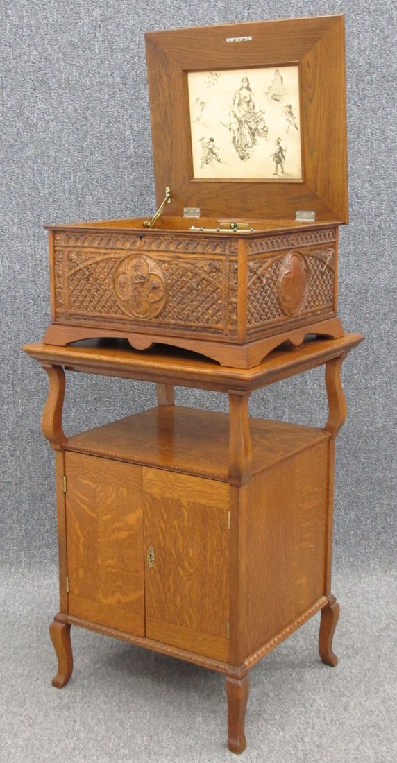 REGINA SINGLE COMB MUSIC BOX with carved case and: REGINA SINGLE COMB MUSIC BOX with carved case and stand note- 29 discs