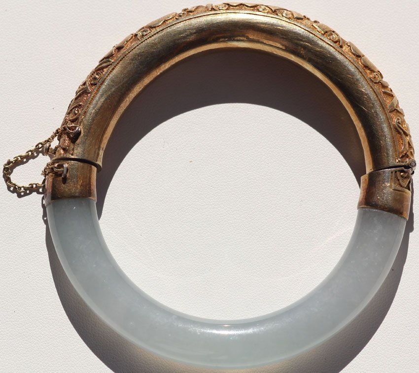 CHINESE GOLD WASH OVER STERLING SILVER AND JADE B: CHINESE GOLD WASH OVER STERLING SILVER AND JADE BRACELET note- hinge need of repair diameter- 3 1/4"