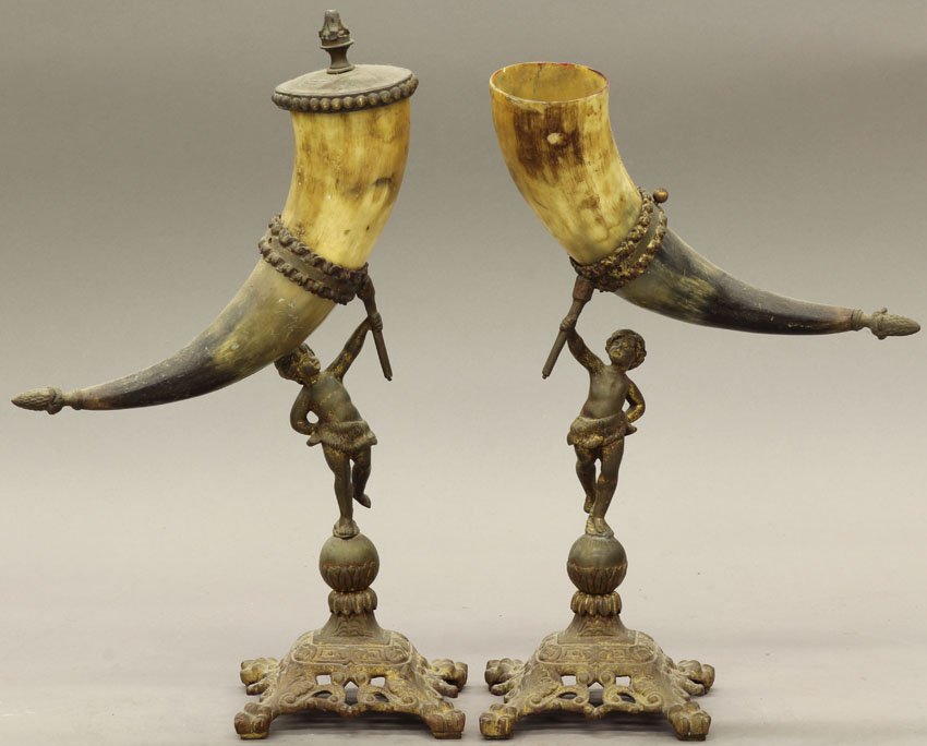 PAIR OF FRENCH CAST METAL STATUES with horn early: PAIR OF FRENCH CAST METAL STATUES with horn early 20th century height- 14"