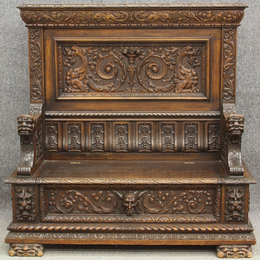 AMERICAN CARVED OAK HALL BENCH with wing griffins, nort: AMERICAN CARVED OAK HALL BENCH with wing griffins, northwind face in the manner of R.J. Horner height- 58", width- 58 1/2"