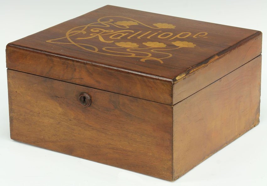 KALLIOPE SINGLE COMB MUSIC BOX: with bells and total of 5 discs Diameter of disc- 9" Condition: Minor losses to wood case wood