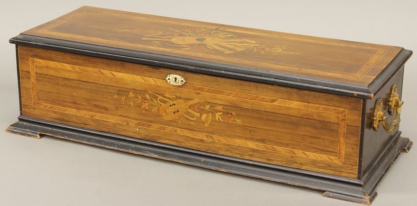 SWISS CYLINDER INLAID MUSIC BOX: with 12 airs Length of cylinder- 16" Condition: Plays, needs tuning