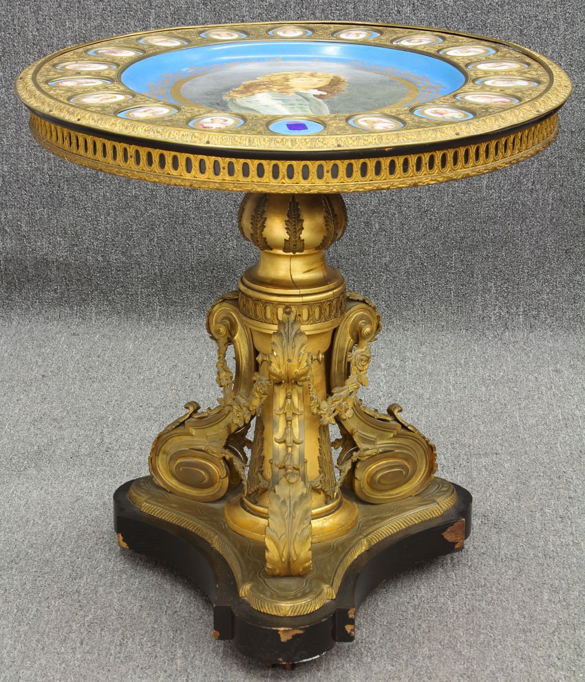 SEVRES PORCELAIN AND BRONZE CENTER TABLE: circa 19th century (18) plaques surrounding (1) large Diameter- 32", Height- 32" Condition: One plaque cracked