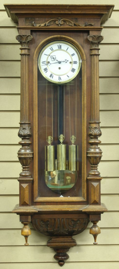 VICTORIAN CARVED WALNUT TRIPLE WEIGHT WALL CLOCK: Length- 45" Condition: veneer missing