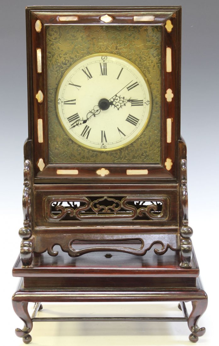 CHINESE CARVED TEAK CLOCK WITH STAND: Height- 21" Condition: no warranties on clock movement