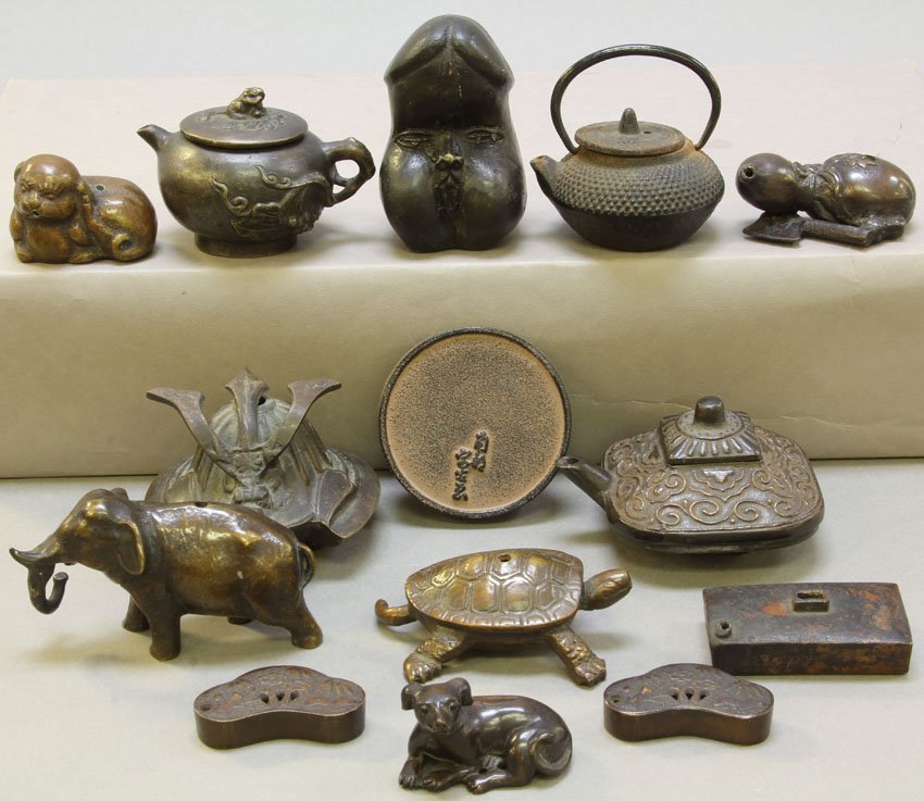 LOT OF (13) CAST METAL ASIAN FIGURAL ITEMS: teapots, chop stick rest Width- 1 1/2"- 3"