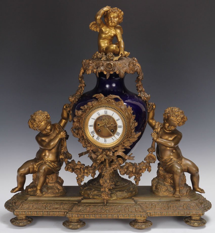 FRENCH BRONZE AND PORCELAIN CLOCK: 19th century Height of Clock- 25 1/4"
