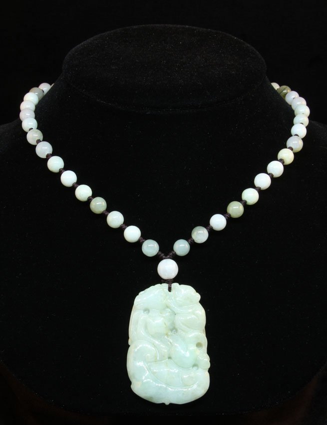 CHINESE CARVED JADE PENDANT AND BEADED NECKLACE: Weight- 65 grams