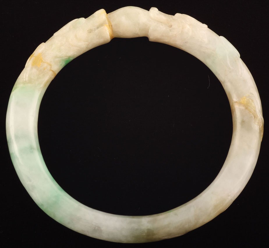 CHINESE CARVED JADE BANGLE BRACELET: 19th century or earlier Diameter- 2 3/4" Weight- 32 grams Condition- (3) repairs