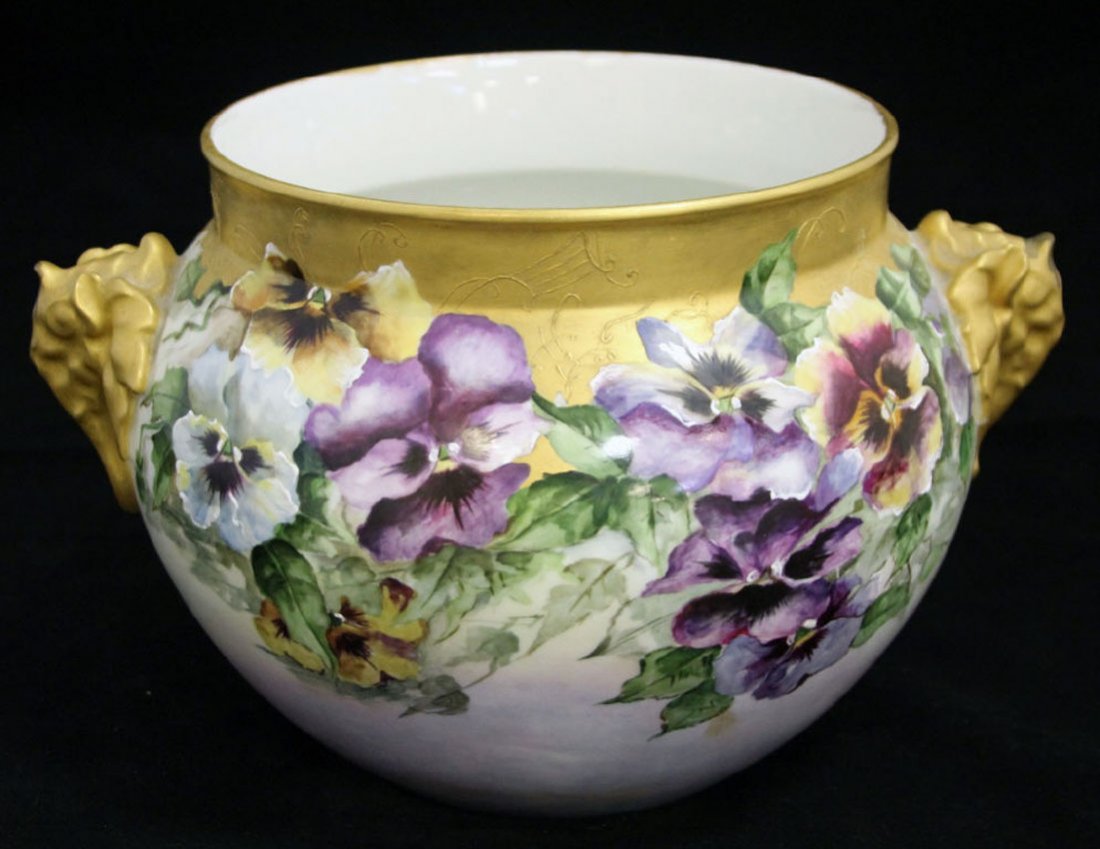 LIMOGES PAINTED URN WITH ELEPHANT HANDLES: late 19th century, early 20th century Height- 8 1/2", overall width- 13 1/2" Condition- repair to one elephant handle