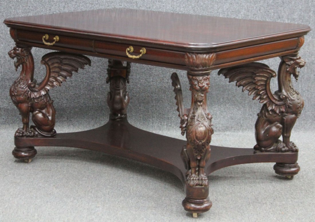 AMERICAN CARVED WINGED GRIFFIN MAHOGANY DESKS: Height- 30 1/4", top- 34 1/4" x 53 1/2"