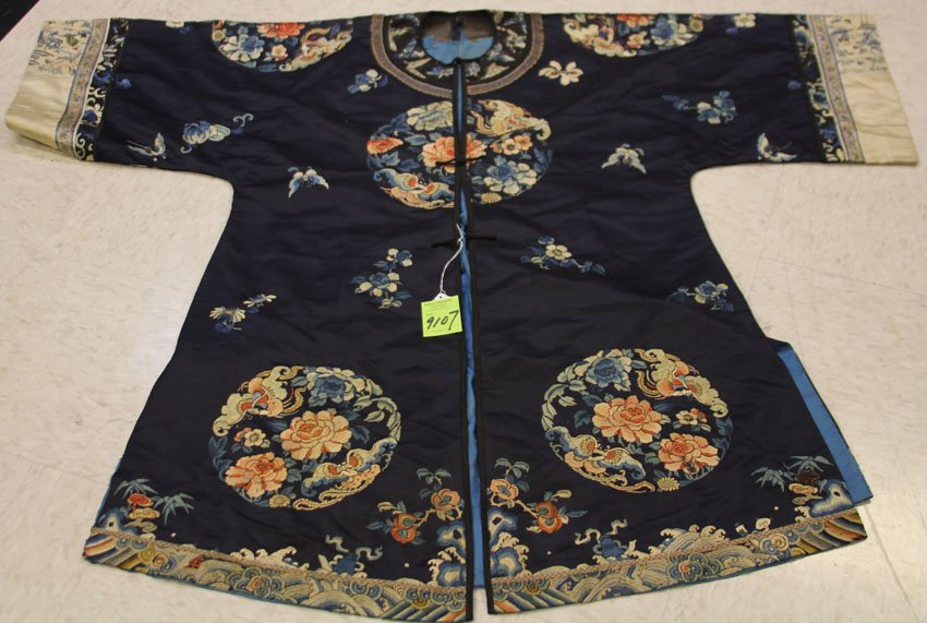 QING DYNASTY EMBROIDERED SILK ROBE: late 19th century/early 20th century with (8) dragons Condition- to fading to collar