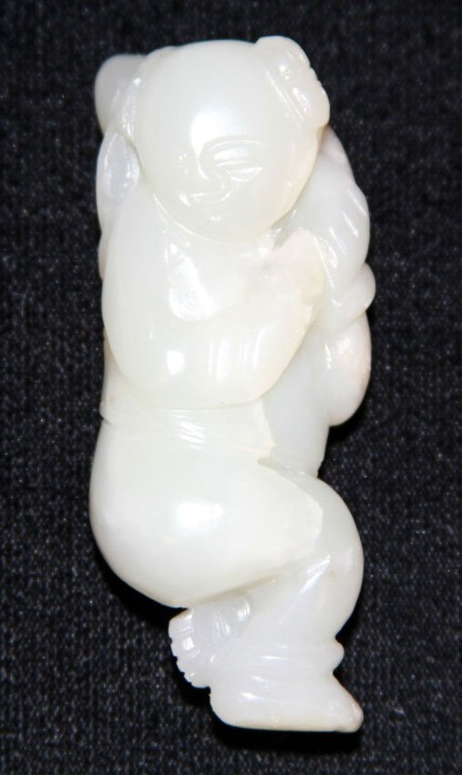 CHINESE JADE CARVING OF BOY, 19TH CENTURY: Provenance- Private Collection Of East Coast Collector Length- 2 1/4" Weight- 37.3 grams
