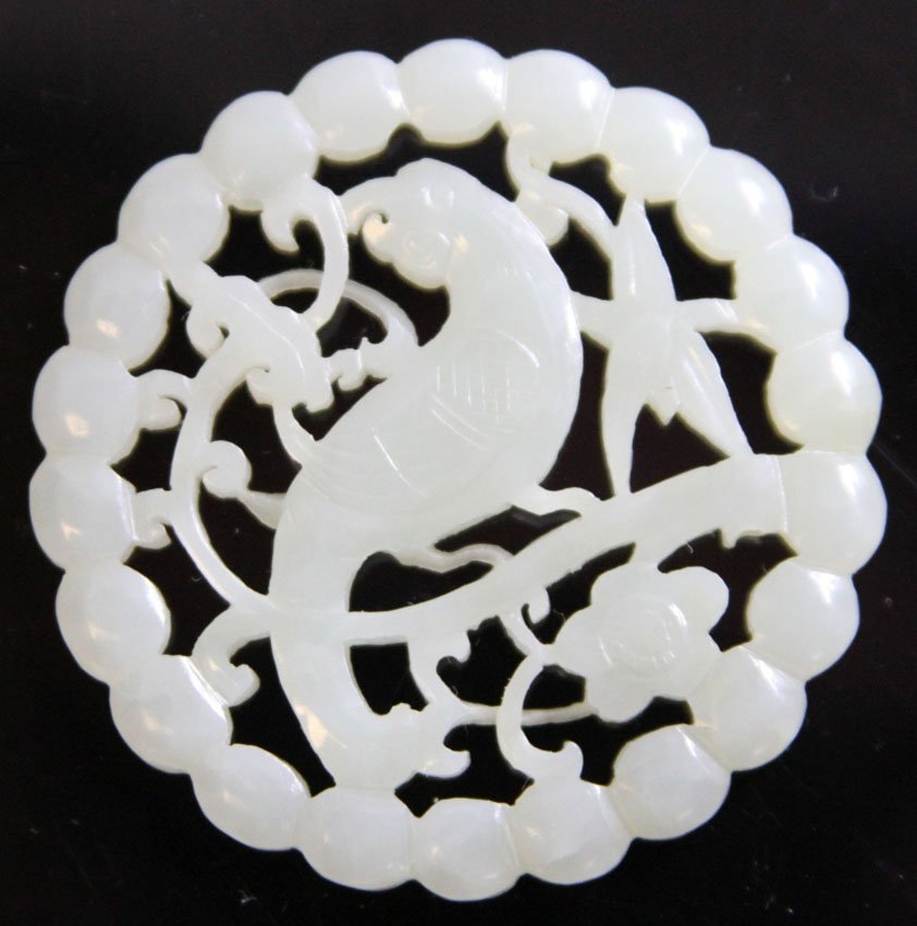 YUAN-MING JADE CARVING- 14TH/15TH CENTURY: Provenance- Private Collection Of East Coast Collector Reference- James Watt, 1981 Diameter- 2 1/8" Weight- 20.8 grams