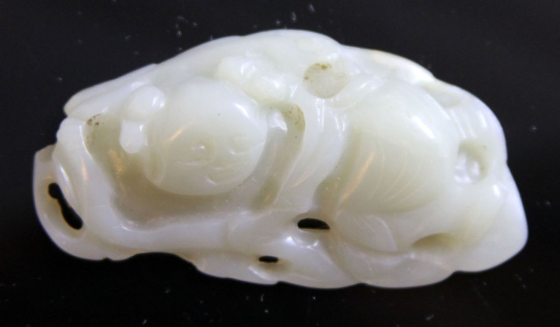 CHINESE JADE CARVING OF BOY ON LEAF, 1900'S: Provenance- Private Collection Of East Coast Collector Length- 2 3/8" Weight- 27.1 grams Condition- loss to carving