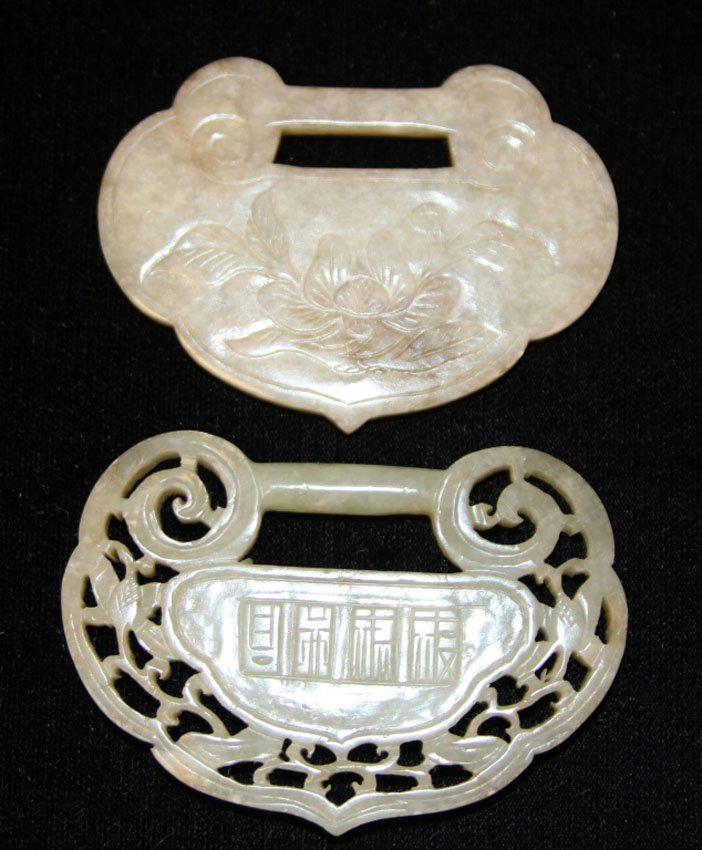 LOT OF (2) CHINESE JADE LOCKS, 19TH CENTURY: Provenance- Private Collection Of East Coast Collector Length- 3"- 3 1/4" Weight- 94.6 grams Condition- surface scratches losses to one