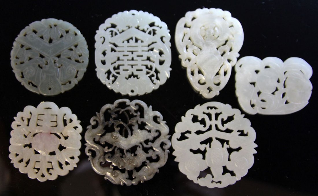 LOT OF (7) CHINESE JADE CARVINGS: 19th/early 20th century Provenance- Private Collection Of East Coast Collector Diameter- 2"- 2 1/4" Weight- 152 grams