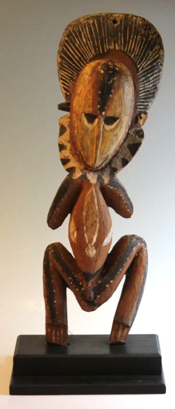NEW GUINEA ABELAM MALE SQUATTING FIGURE: mounted to profession stand Overall height- 27 1/2" Louis A. Allen Collection Partial old loss to left arm