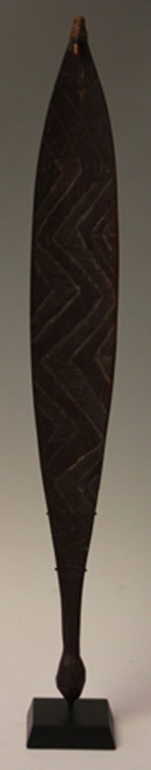 AUSTRALIAN ABORIGINAL WOOMERA SPEAR: thrower with carved figures Provenance- Conway Collection, Arizona Length- 31 1/2" Overall- 33 1/4" (on stand)
