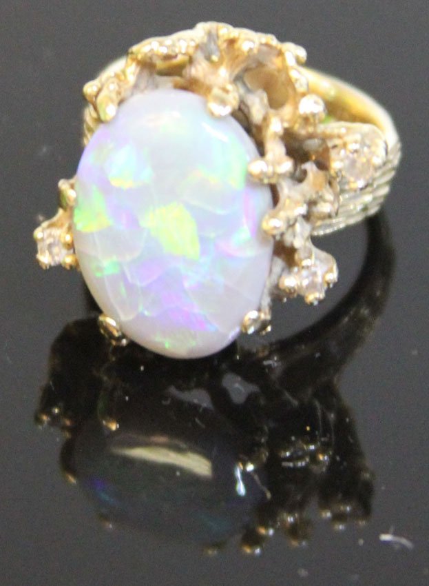 VINTAGE OPAL 14KT LADY'S RING: Ring size- 6.5 Weight- 11.4 gramsOpal stone a little loose