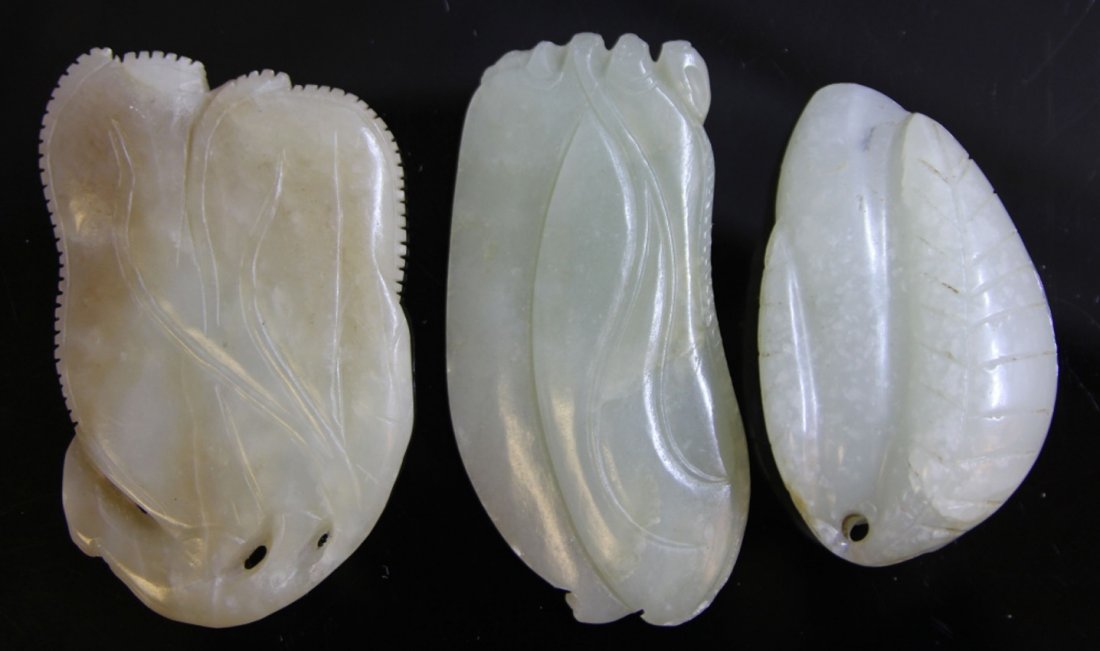 LOT OF (3) CHINESE JADE CARVINGS: 19th/early 20th century Provenance- The Sutton Collection Botanical carvings Length- 2 1/4" - 2 7/8" Weight- 147.3 grams