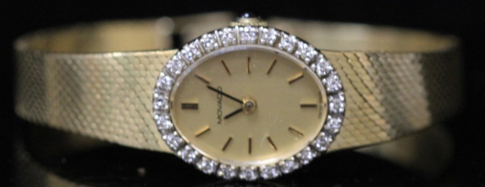 MOVADO 14KT DIAMOND WRISTWATCH: Weight- 26.6 grams Length- 6 1/4"