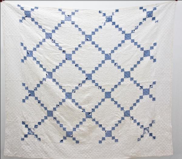 1930's Hand Stitched Quilt: 1930's hand stitched, double bed (73"x82") quilt in the Irish chain pattern. There are 7-8 stitches per inch and it is made out of old tuxedo brand flour sacks.