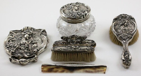 6 Piece Art Nouveau Sterling Dresser Set: All pieces are marked sterling. Comb is different then the other 5 pieces. Silver mark is "w" with arrow for Webster Co. of Attelboro, Mass. The glass is cut glass