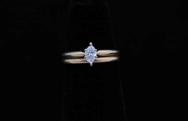 Lady's Marquise Diamond Ring: Lady's diamond ring set in 14kt yellow gold, 2.6 grams twt. Diamond is approx. .25 carats. Estate jewelery