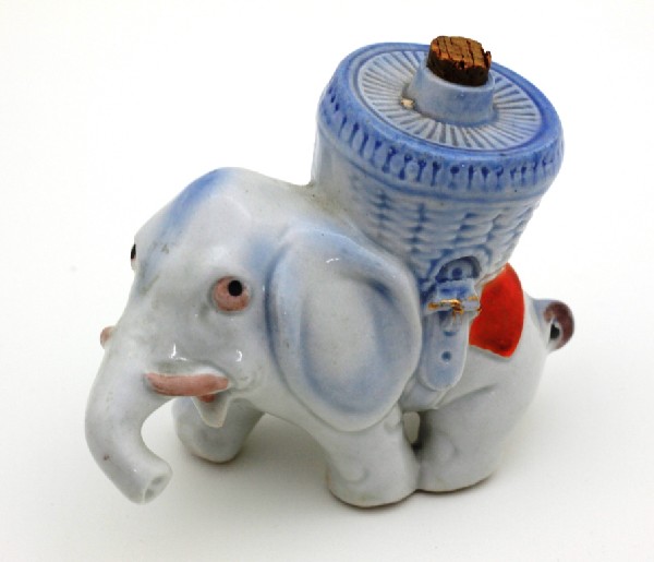 Figural Elephant Mini Whiskey Bottle: Mini whiskey bottle marked "Germany" on the bottom. Approximately 4-1/2" x 2" x 3-1/2"