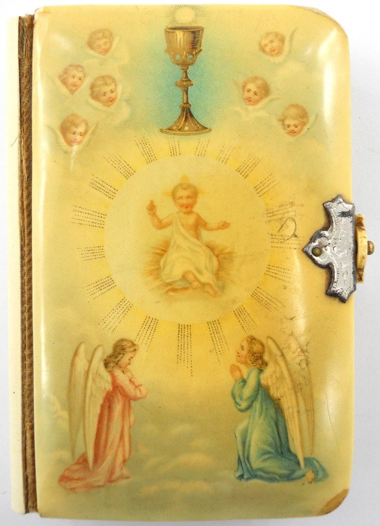 Early Celluloid Miniature German Bible: Here is a great piece of history you don't see everyday: an early German Bible with a celluloid cover and latch. Featured on the inside is a cut-out celluloid cross with a metal image of Jesus. There 