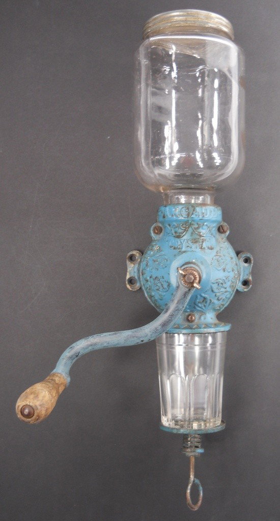 Arcade Crystal #3 Coffee Grinder: This is an original vintage Arcade Crystal #3 wall mount coffee grinder that looks to be in working condition, complete with the original cup on the bottom. Made of cast iron and painted a great blue 