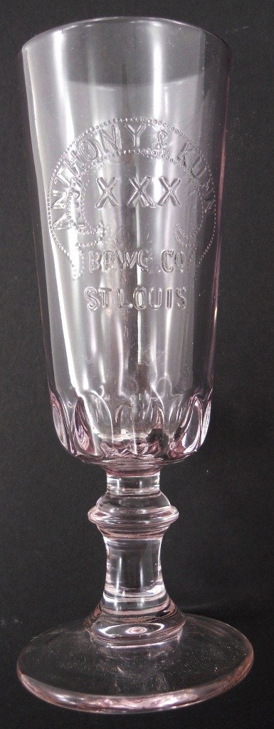 Pre-Prohibition Embossed Footed Glass: This glass is from the Anthony & Kuhn Brewing Co. of St. Louis, which failed in 1883. The glass is turning a great, interesting purple from the magnesium that was put in glass prior to the 1st World W