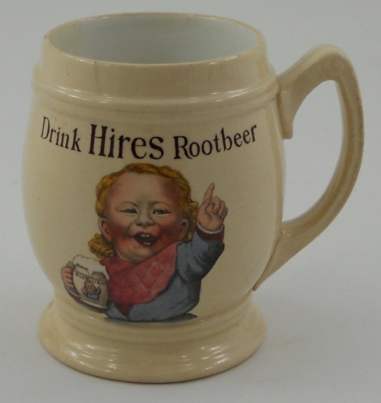 Original Hires Root Beer Mettlach Mug: This is an early original Mettlach, Germany Hires Root Beer Mug. The image of the boy with his mug of foaming root beer is great! Looking inside the mug, you will notice the original syrup line. The b