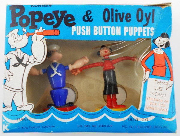 Popeye & Olive Oyl Push Button Puppets - SET!: Vintage 1960s Popeye & Olive Oyl Push-Button Puppets! Made in the 1960s by Kohner Bros. Inc. There is a copright for King Features Syndicate on the front of the box. The puppets are standing up with a