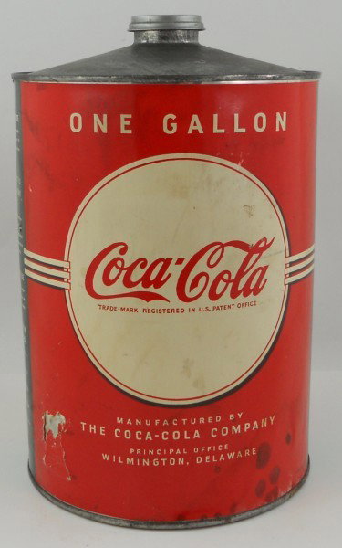 Coca Cola One Gallon Cone Top Syrup Can: This is a paper label 1940s Coca Cola One Gallon Cone Top Syrup Can. It was for fountain use and held Coca-Cola concentrate syrup. The can displays well and even has the original cap. The label has so